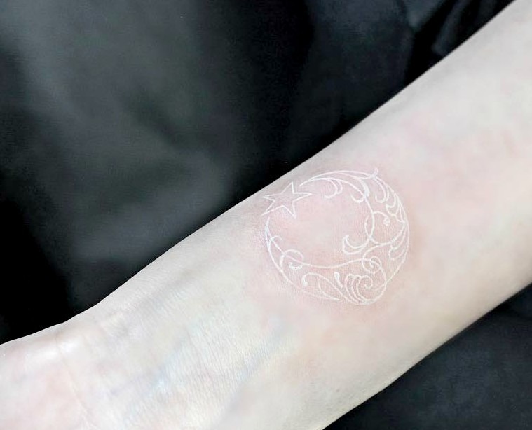 Celestial White Ink Tattoo Design with Flourish Embellishments Tattoo Design