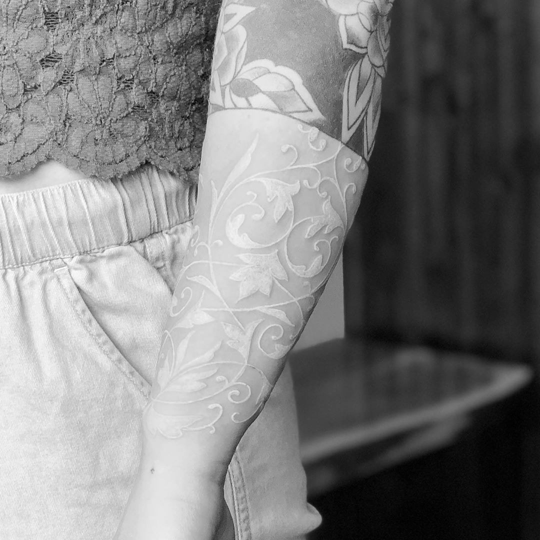 Delicate Lace Flourishes on the Skin White Ink Tattoo Tattoo Design