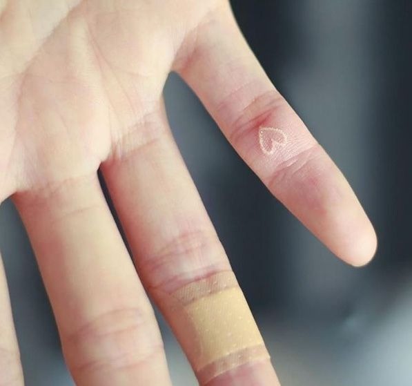 Hand TattooIdea: Heart Outline on the Right Hand White Ink Tattoo Tattoo Design