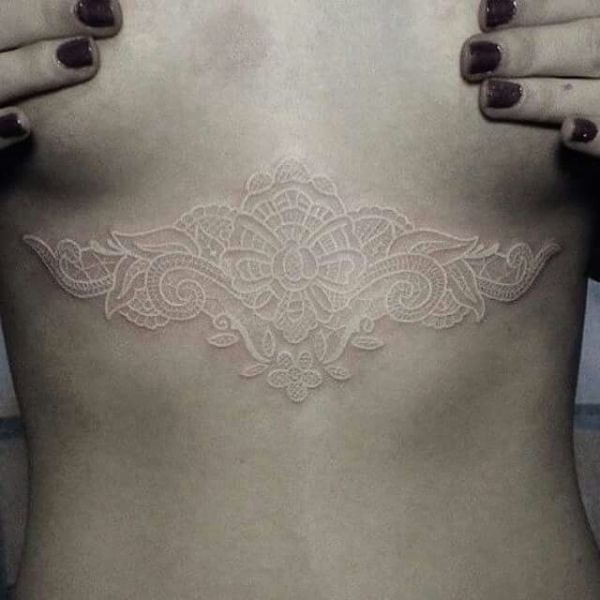 Lace Embellishments on the Chest White Ink Tattoo Tattoo Design