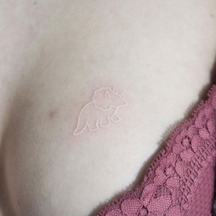 Play With Juxtaposition of Size in White Ink Tattoo Tattoo Design