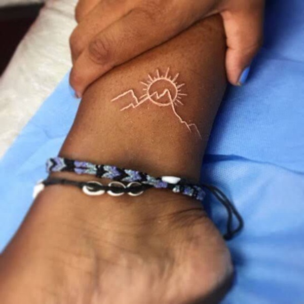 Sun Shining on Top of a Mountain White Ink Tattoo Tattoo Design