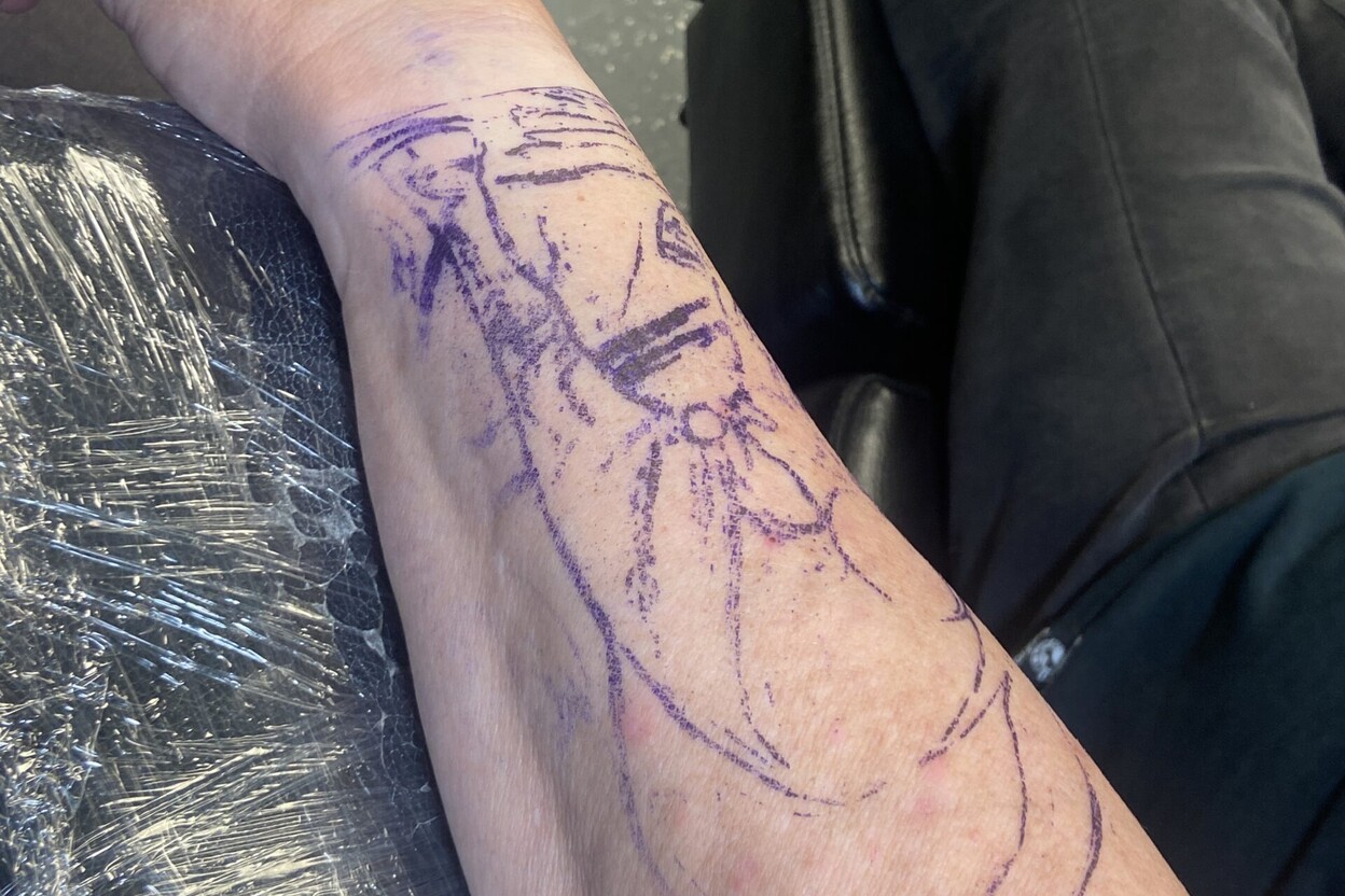Purple tattoo stencil on skin used to explain why your tattoo stencil keeps smudging