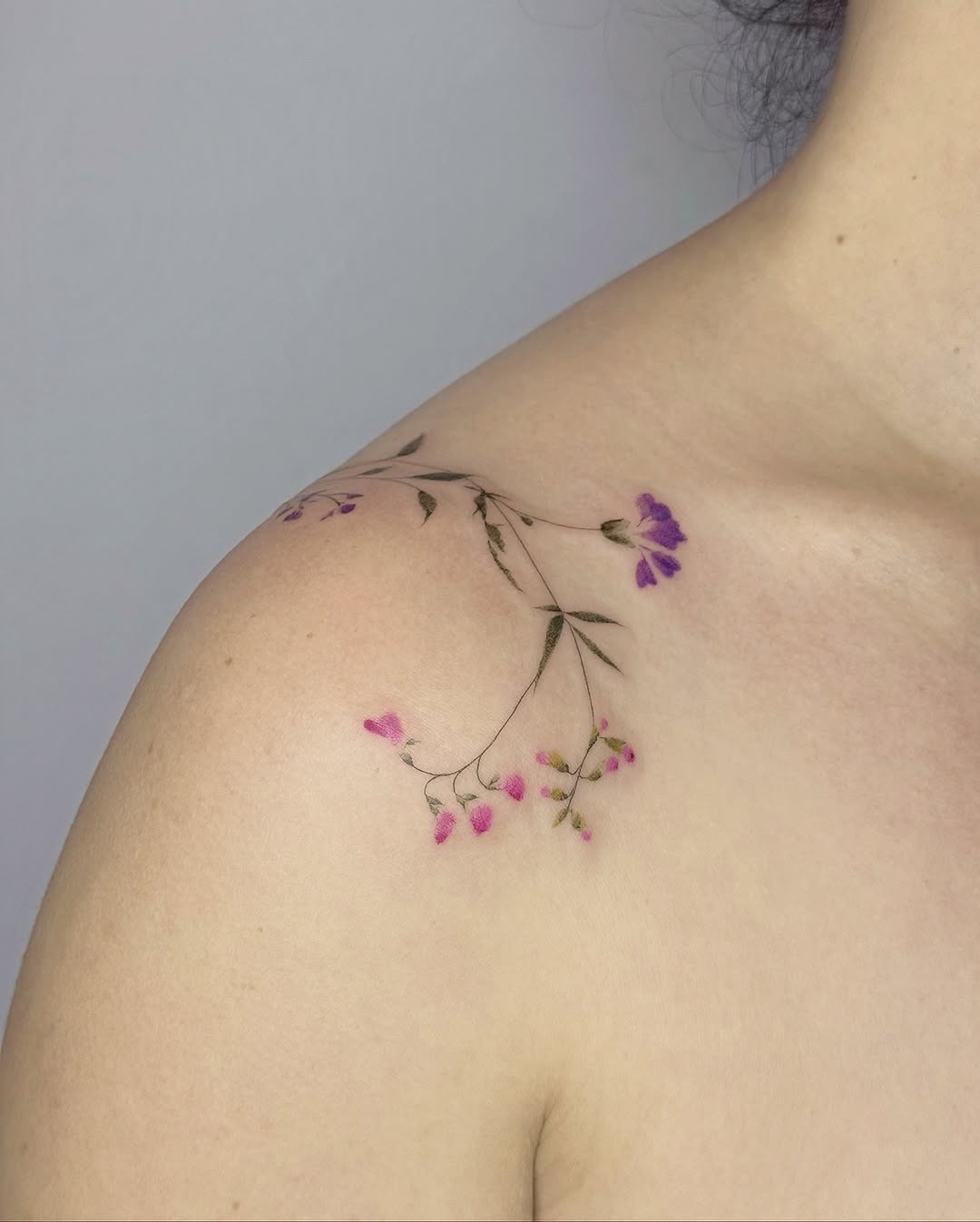 Charming wildflower tattoo adorning the shoulder Tattoo Design