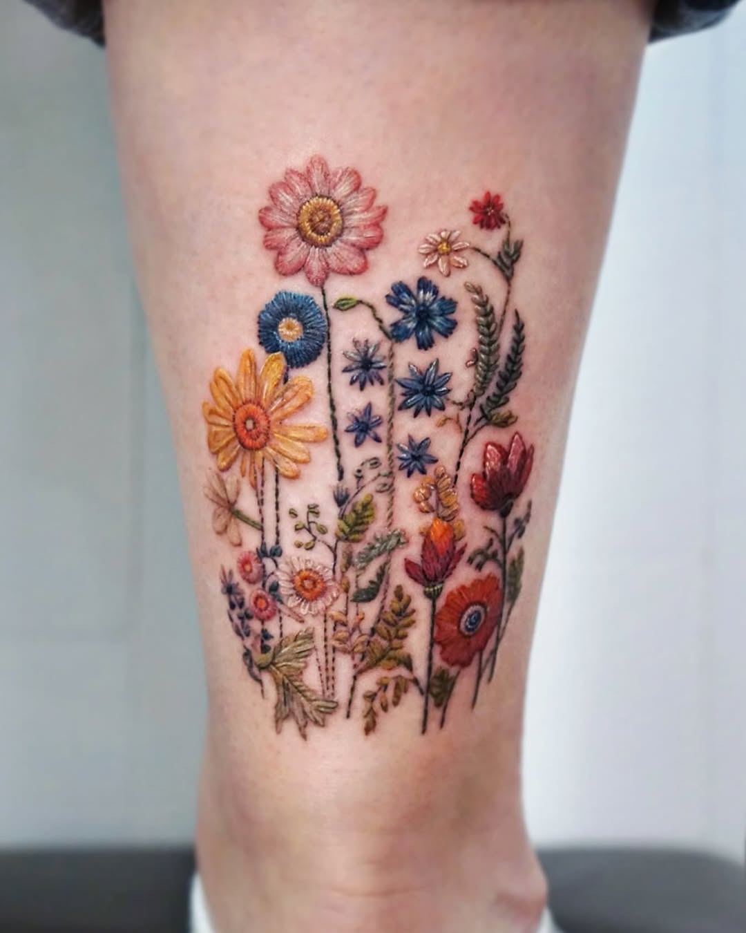 Colorful wildflower tattoo with intricate detailing Tattoo Design