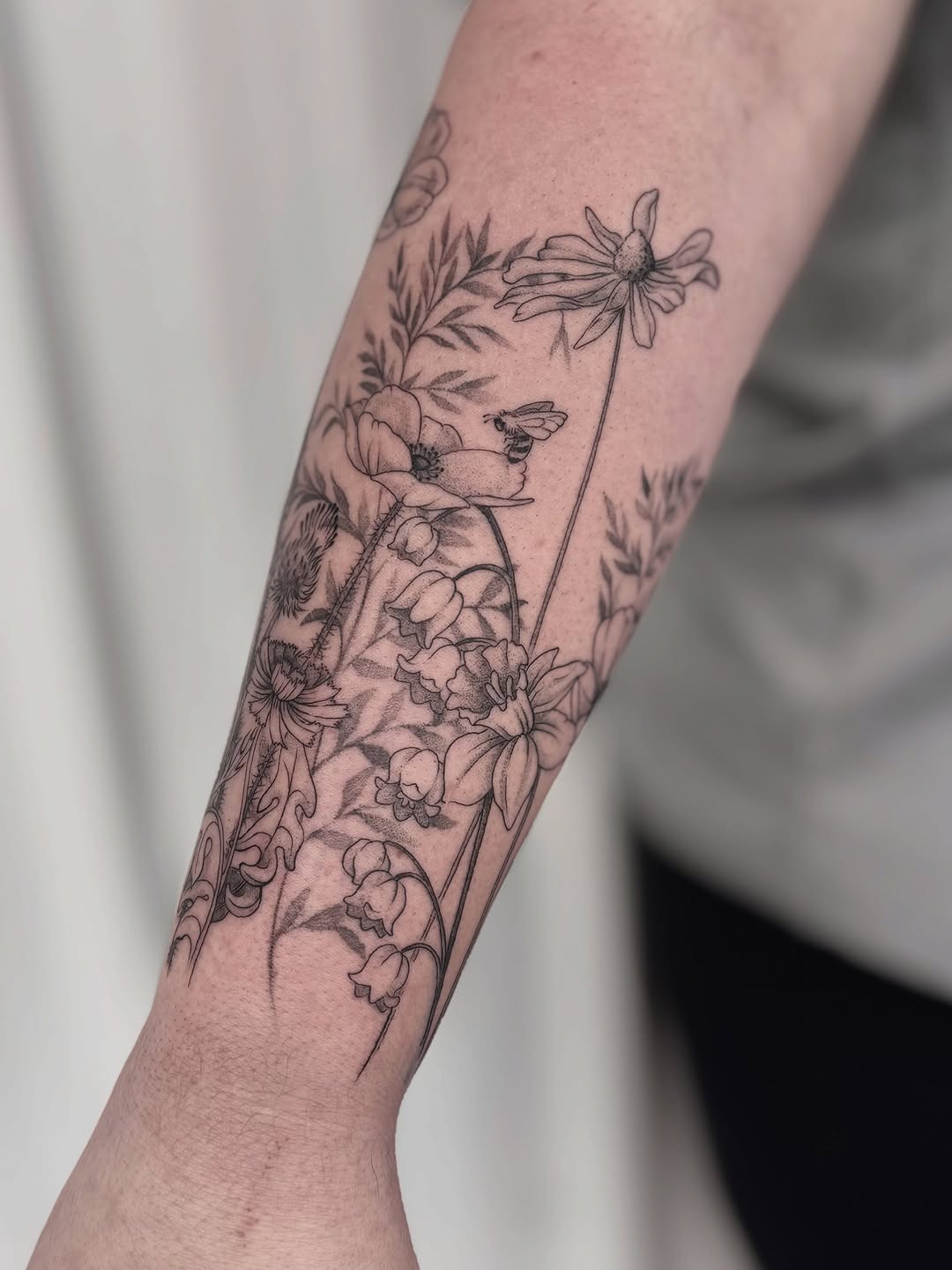 Graceful wildflower design on a forearm tattoo Tattoo Design