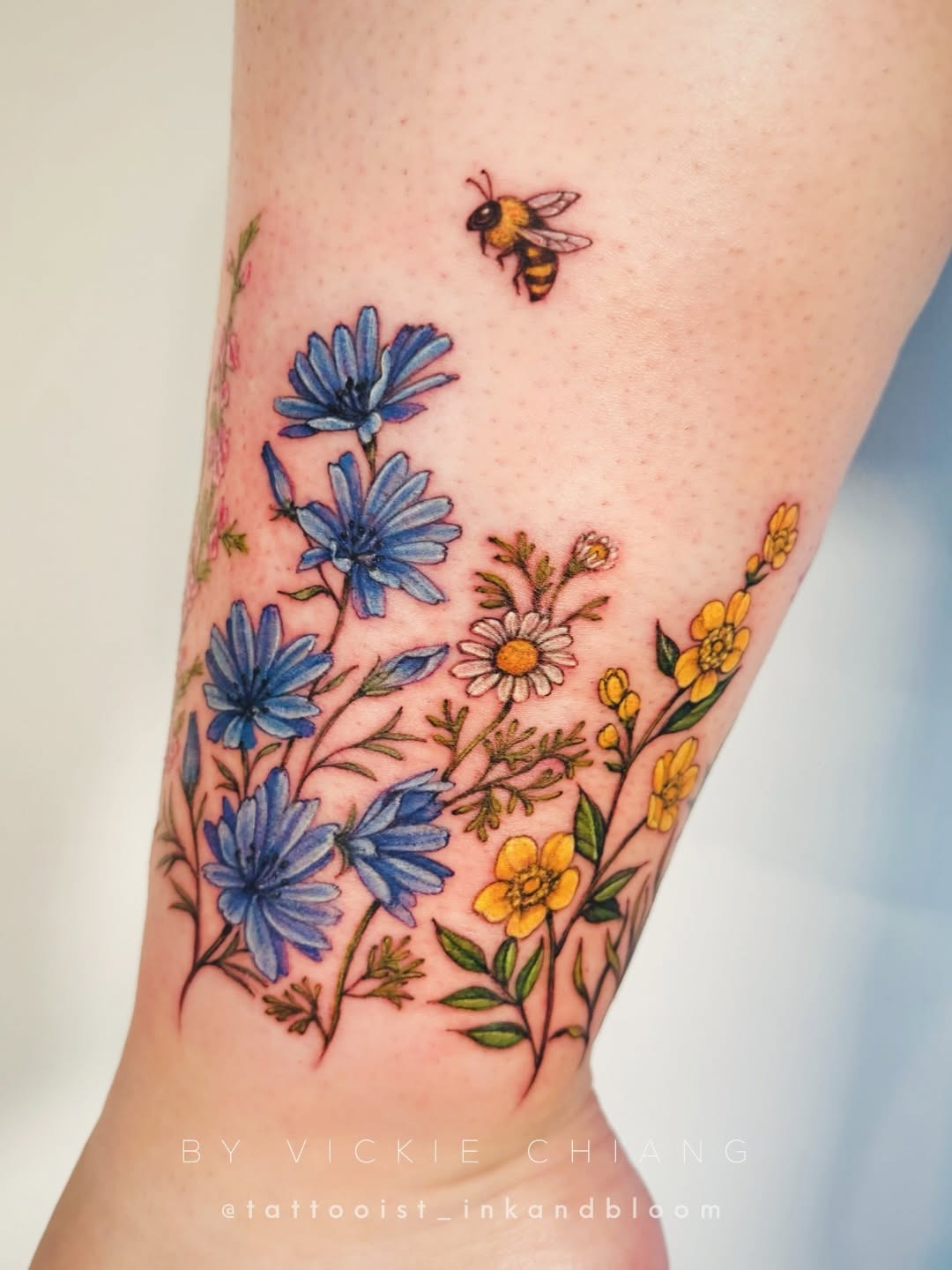Vibrant wildflower tattoo featuring delicate details Tattoo Design