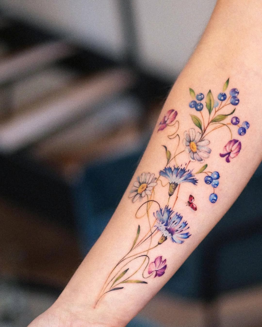 Vibrant wildflower tattoo with intricate details Tattoo Design