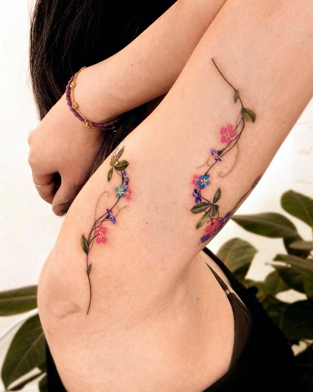 Vibrant wildflowers blooming along the arm Tattoo Design