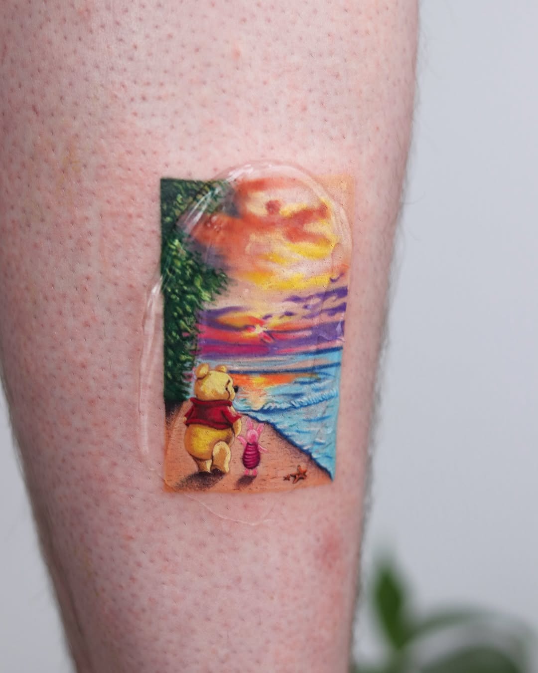 Charming Pooh Enjoys a Beach Sunset Walk Tattoo Design