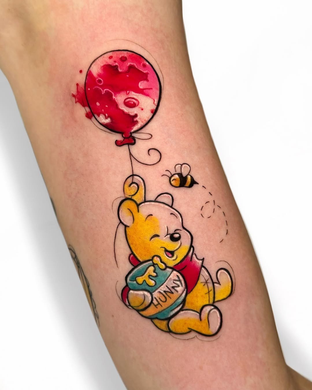 Cheerful Winnie the Pooh Tattoo with Balloon Tattoo Design
