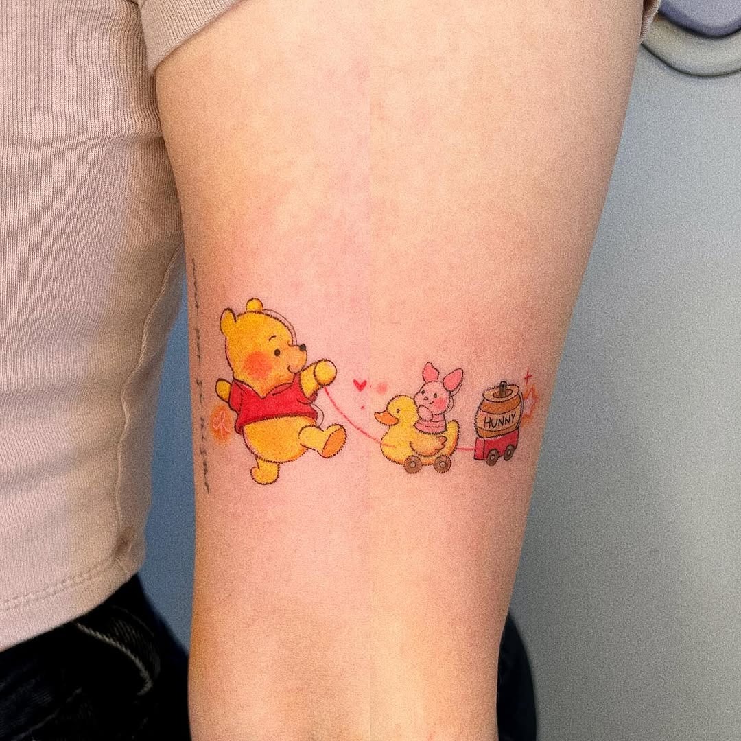 Playful Winnie the Pooh Tattoo with Friends Tattoo Design