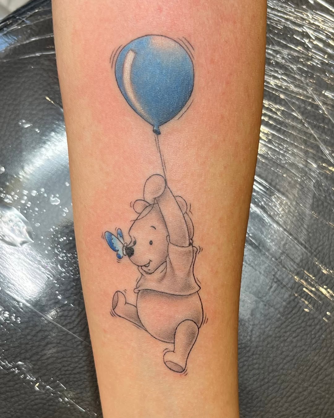 Whimsical Winnie the Pooh with Balloon Tattoo Tattoo Design