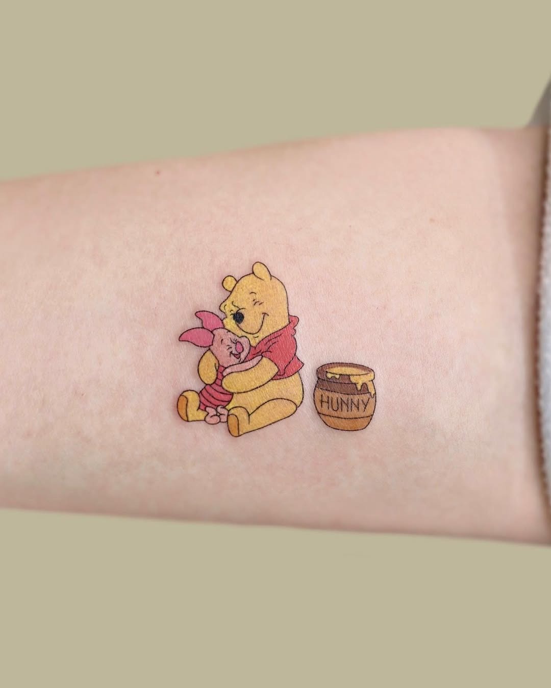 Winnie and Piglet in a sweet hug Tattoo Design