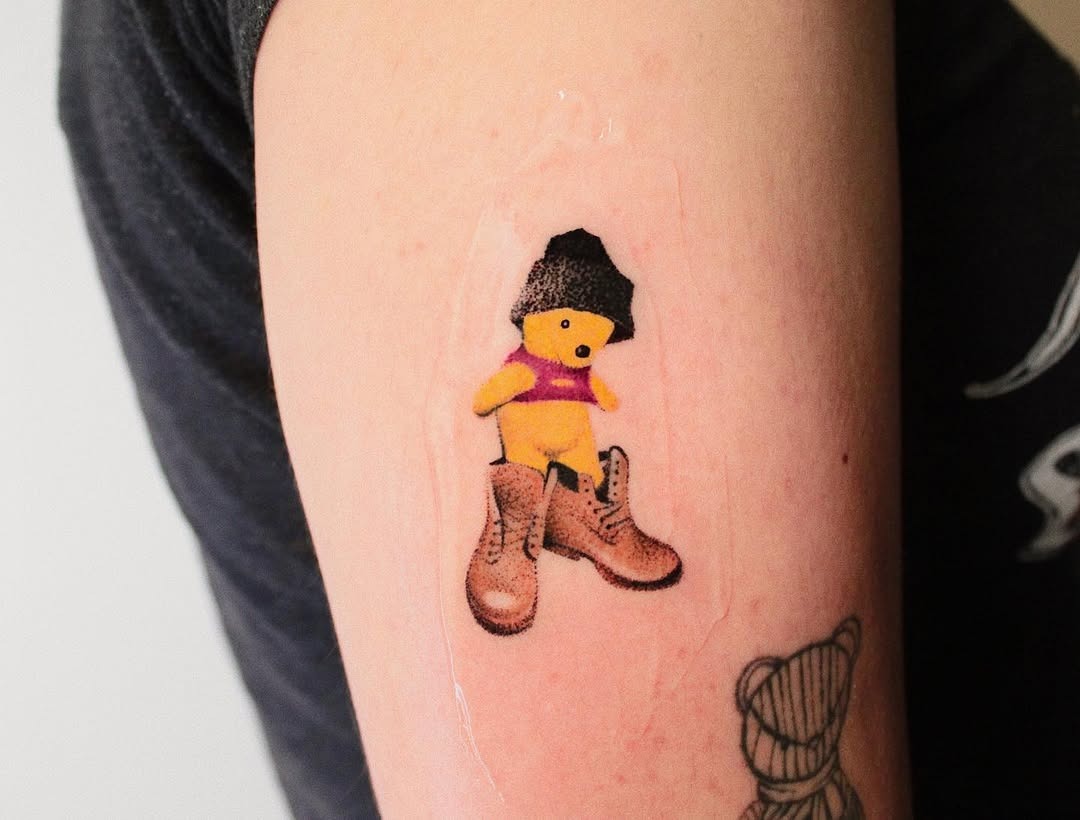 Winnie the Pooh in Unique Fashion Statement Tattoo Design