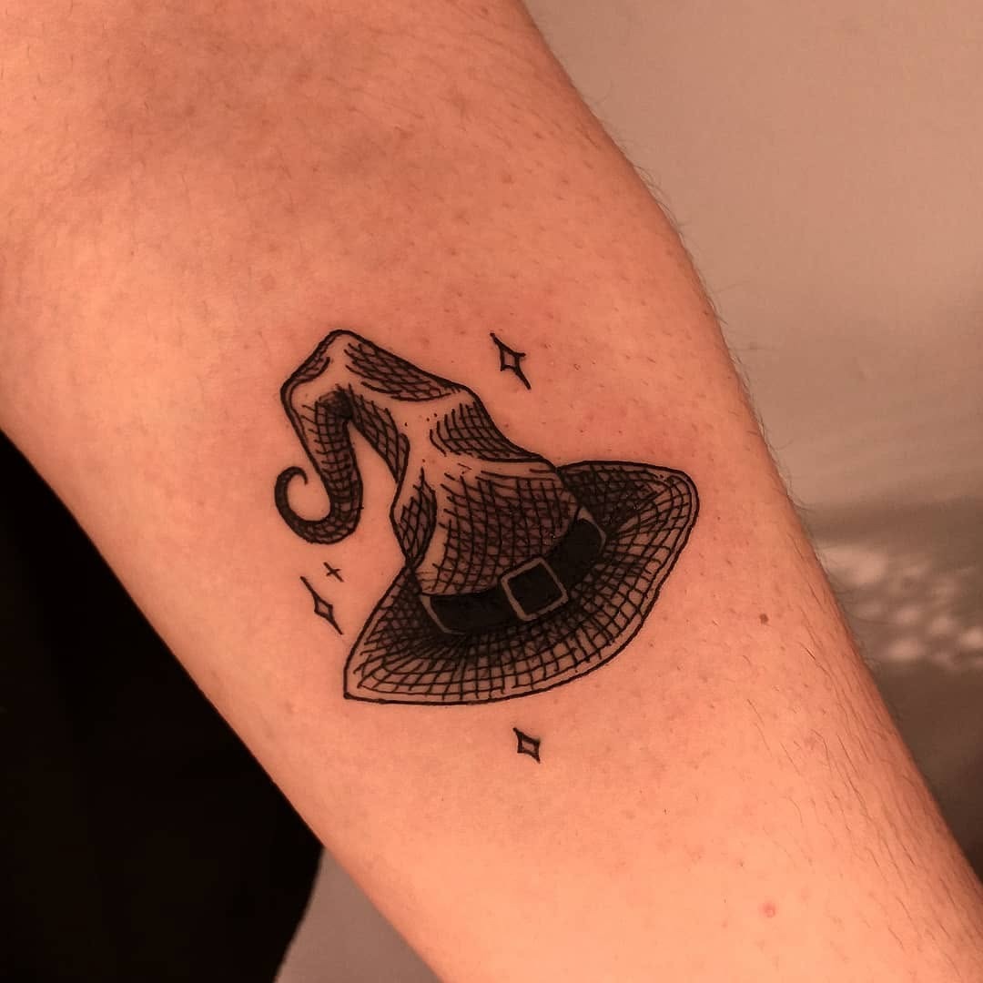 Charming witch hat tattoo with intricate details Tattoo Design