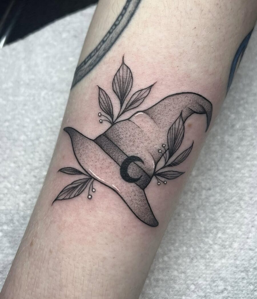Charming Witch Hat Tattoo with Leaf Accents Tattoo Design
