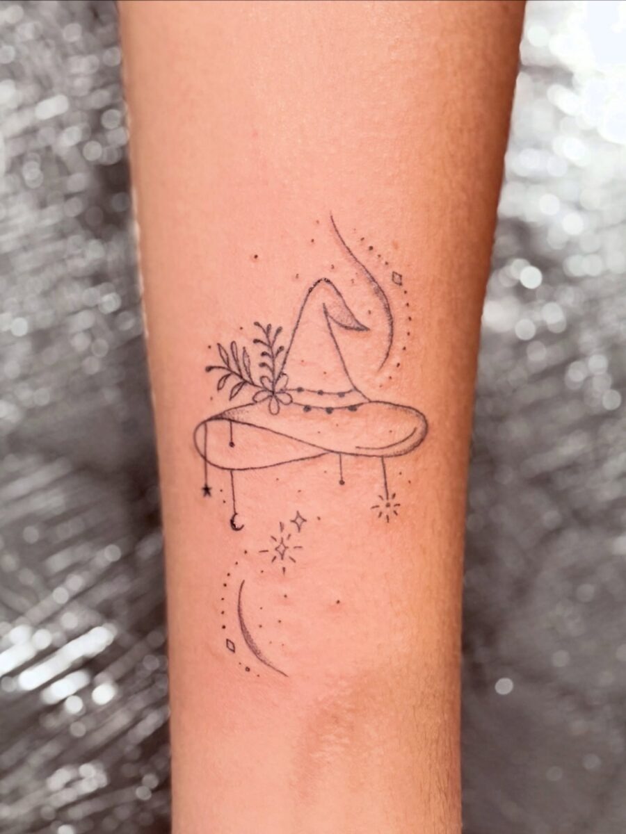 Whimsical witch hat adorned with nature and stars Tattoo Design