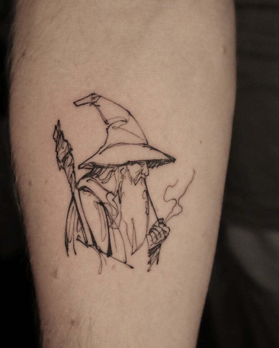 Wizardly charm captured in minimalist tattoo art Tattoo Design