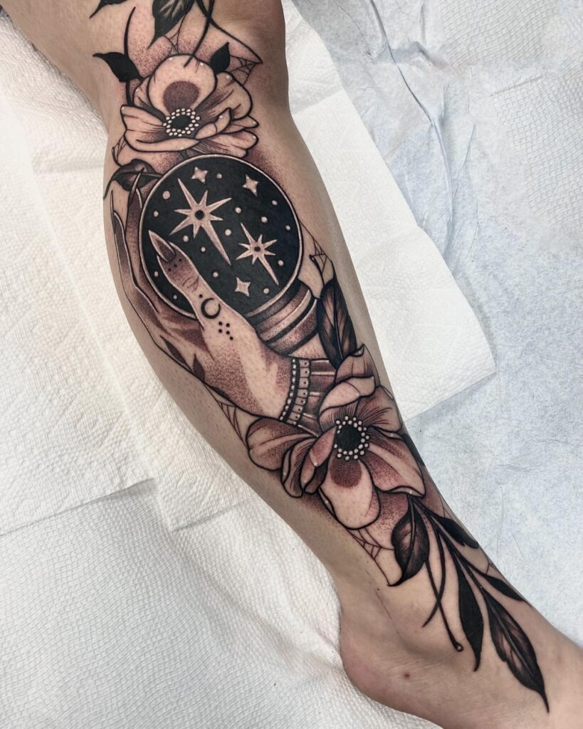 Crystal Ball with Witchy Hand and Flowers Tattoo Tattoo Design
