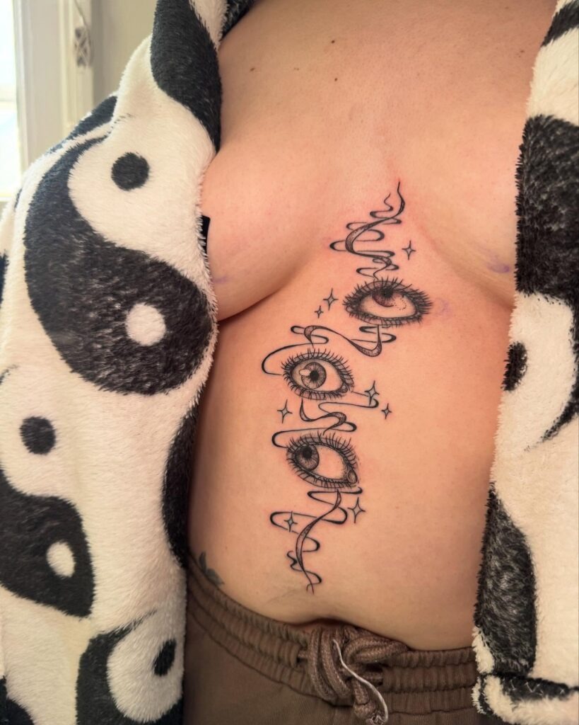 Mystical Eyes with Stars and Flowing Ribbons Tattoo Design