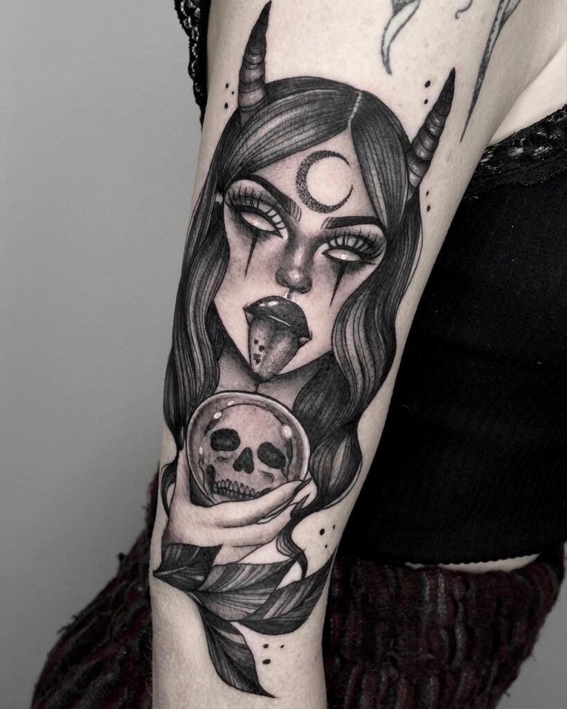 Mystical Witch Holding a Crystal Skull Tattoo Design