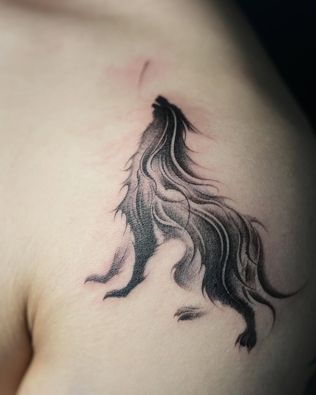 A howling wolf silhouette with flowing lines Tattoo Design