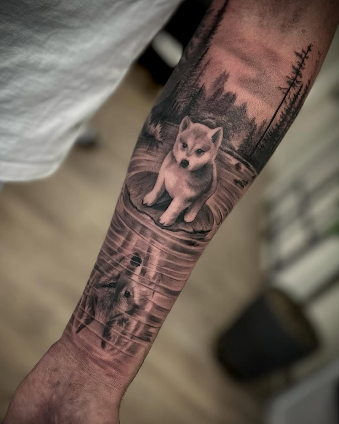 Captivating wolf tattoo with a serene background Tattoo Design