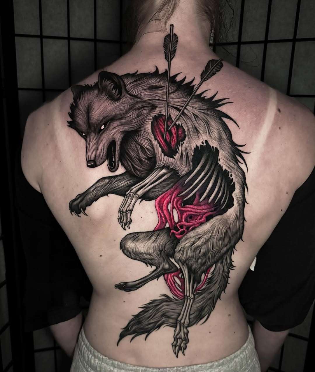 Dynamic wolf tattoo with striking colors Tattoo Design