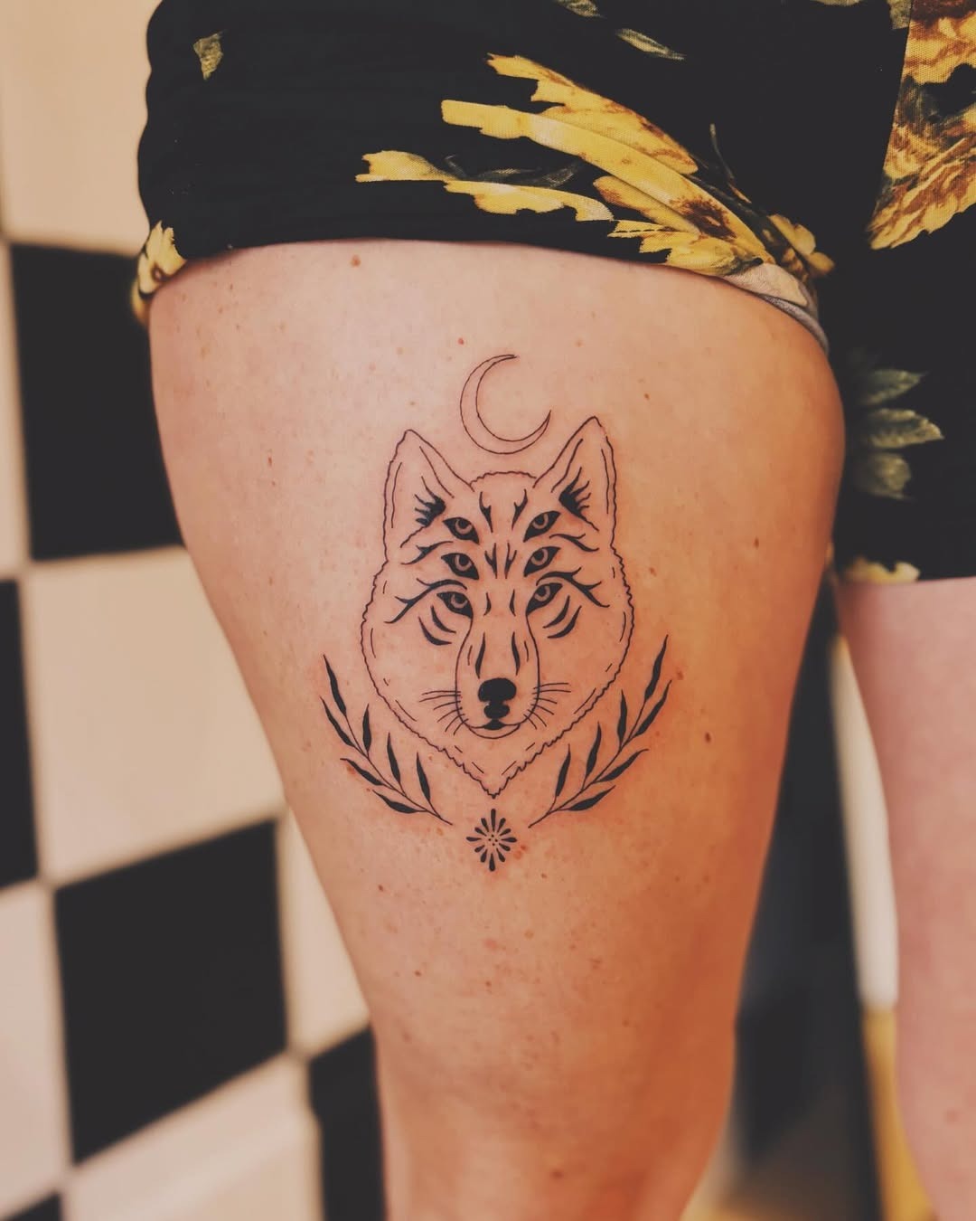 Intricate wolf tattoo with moon and floral elements Tattoo Design