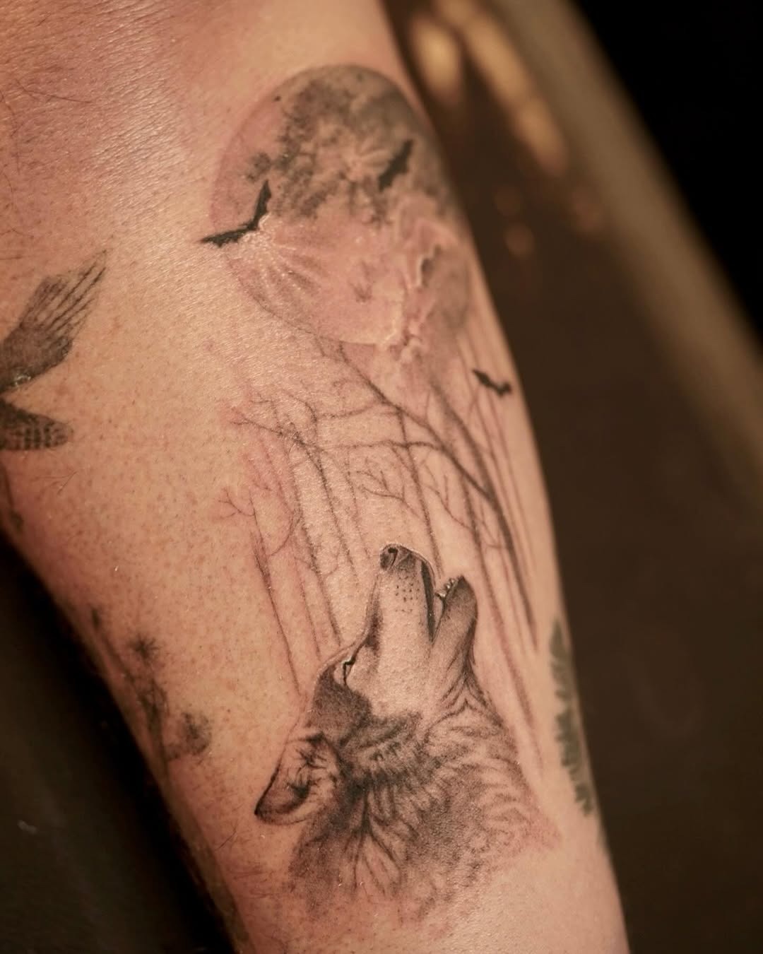 Majestic wolf howling under a full moon Tattoo Design