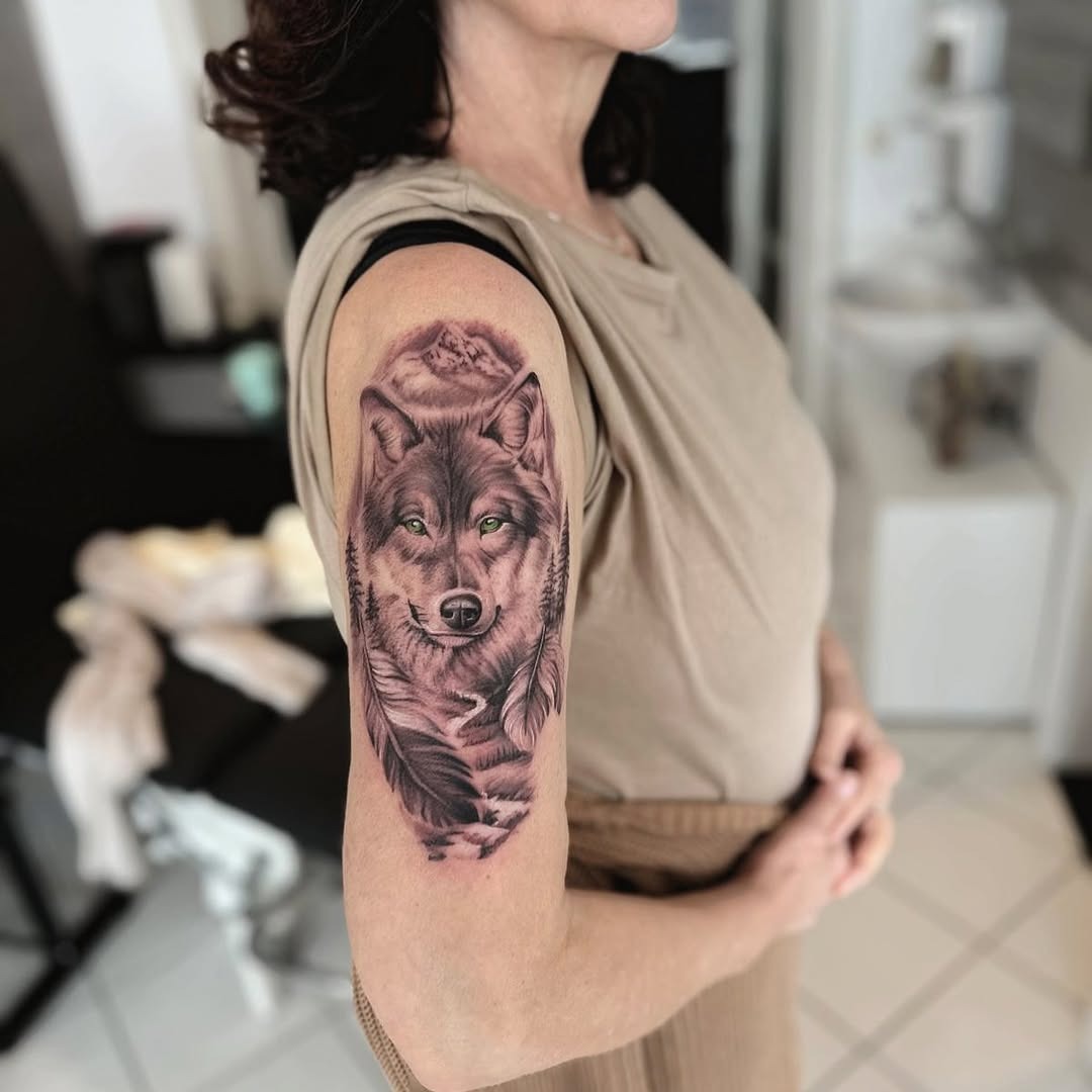 Realistic wolf tattoo on feminine arm Tattoo Design