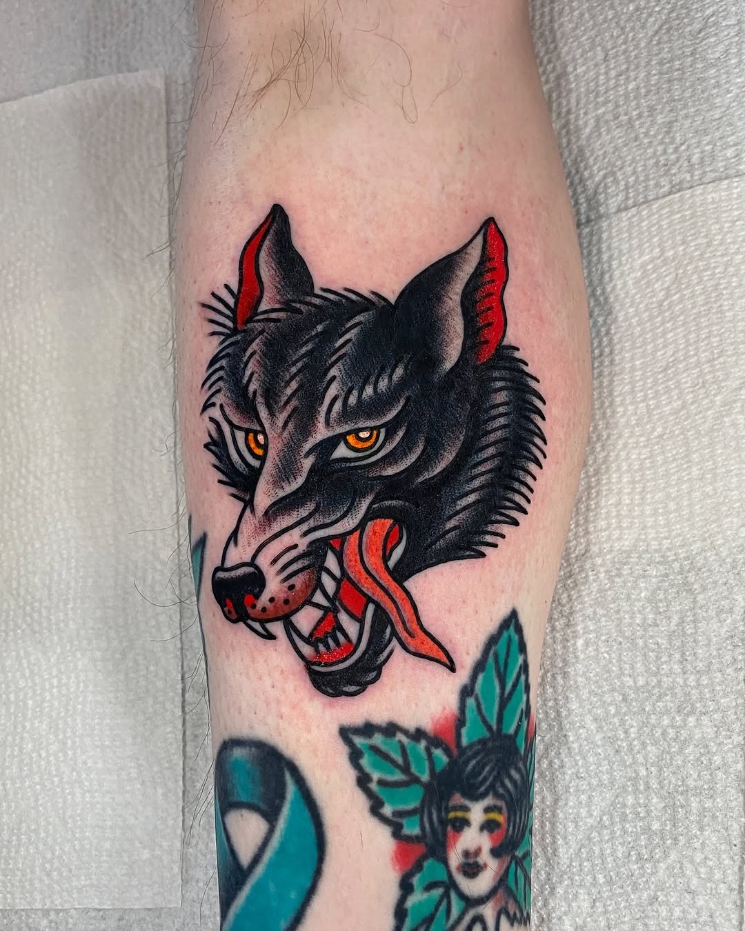 Striking vintage wolf tattoo with bold colors Tattoo Design