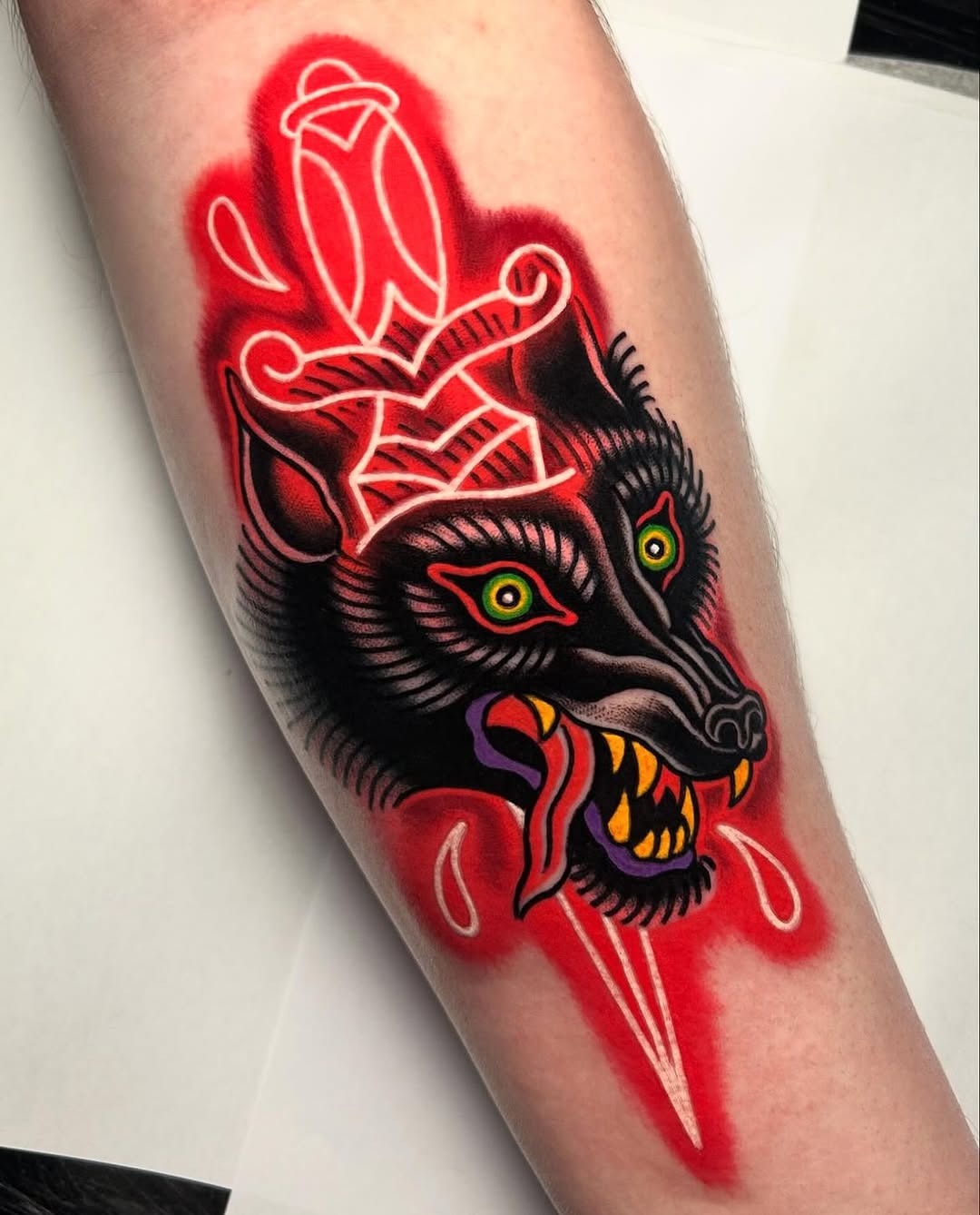 Striking wolf tattoo with bold, vibrant colors Tattoo Design