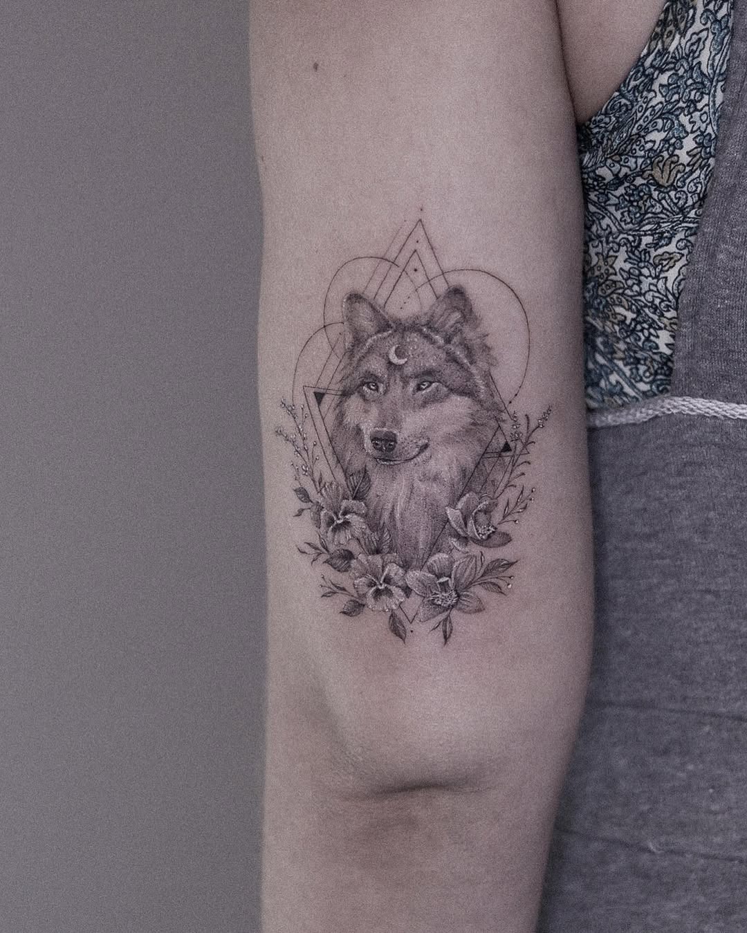 Stunning wolf tattoo with floral elements Tattoo Design