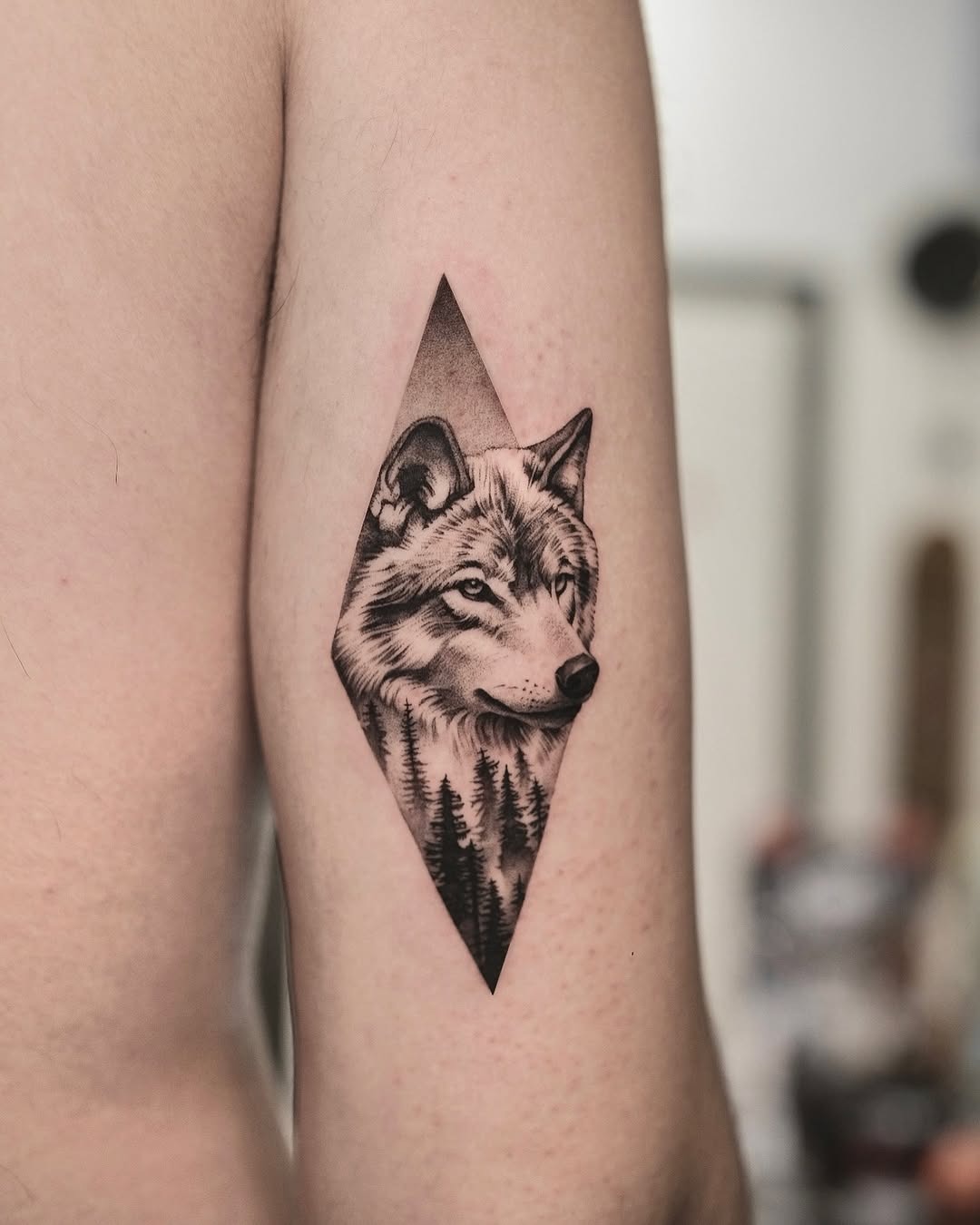 Stunning wolf tattoo with forest backdrop detail Tattoo Design