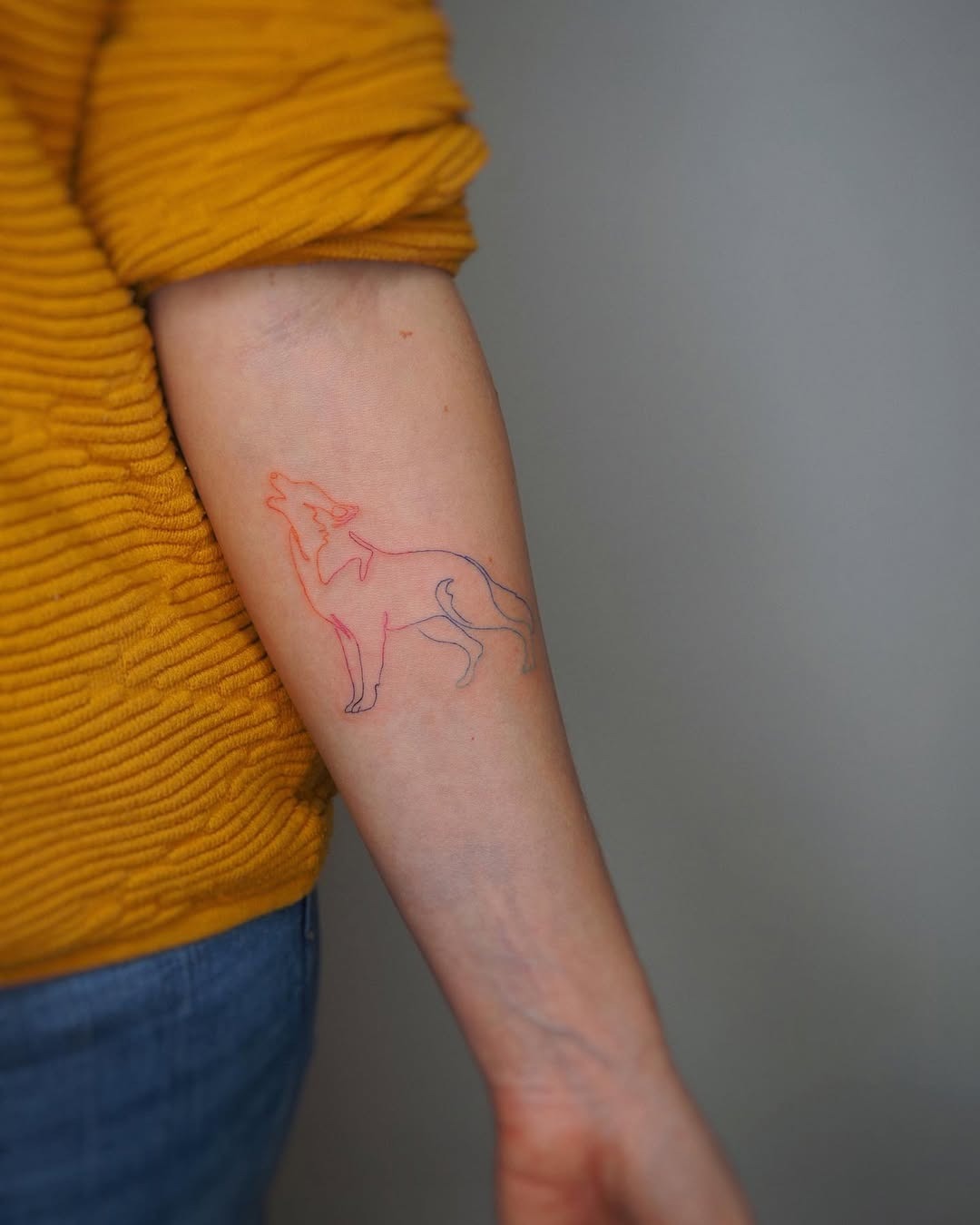Stylish and minimalistic wolf outline tattoo Tattoo Design