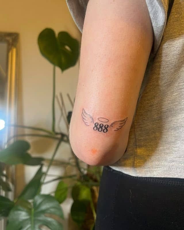 888 with wings on the back of the arm Tattoo Design