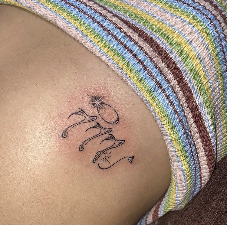 Curvy script 777 hip tattoo Tattoo Design