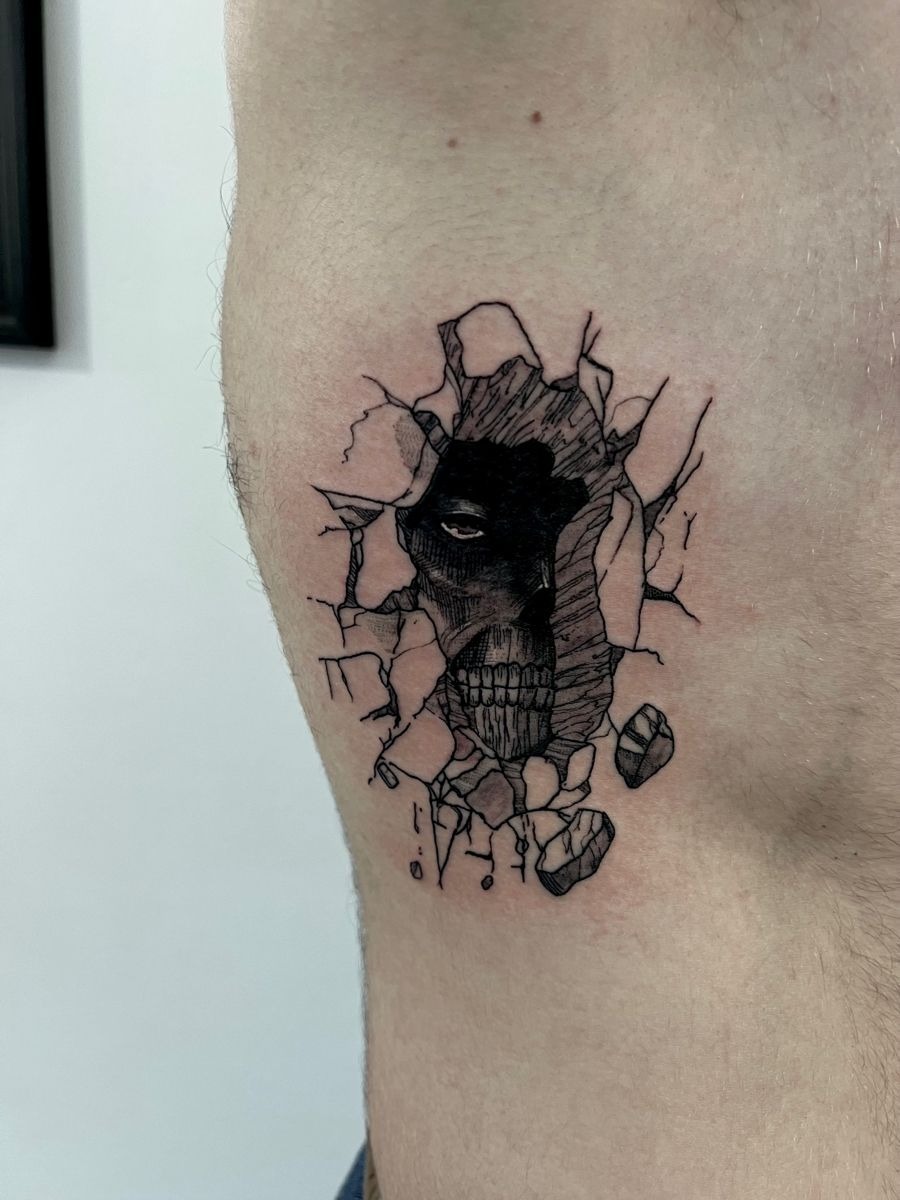 Cracked Wall Titan Rib Tattoo Tattoo Design