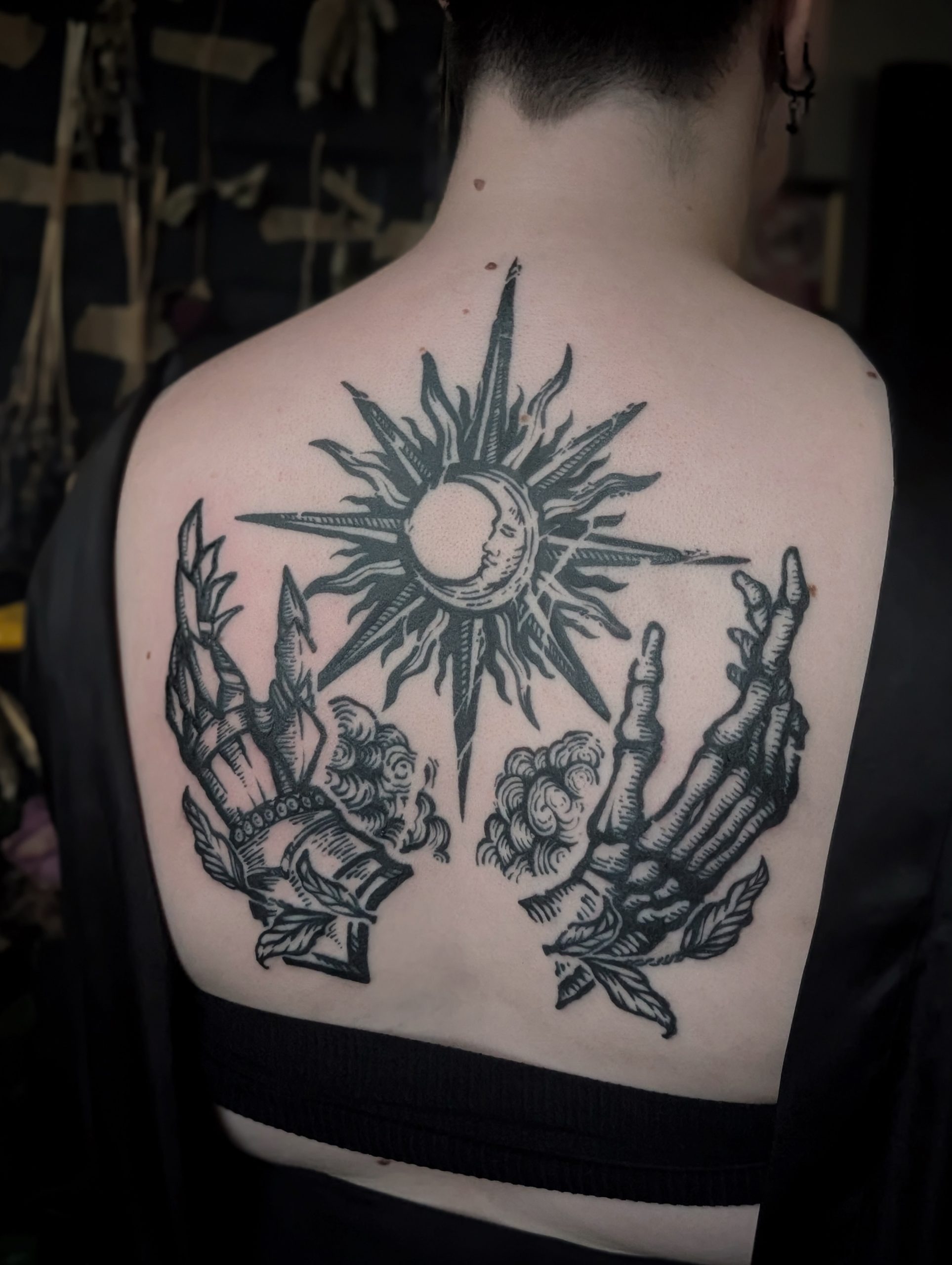 Sun Moon and Praying Skeleton Hands Back Tattoo Tattoo Design