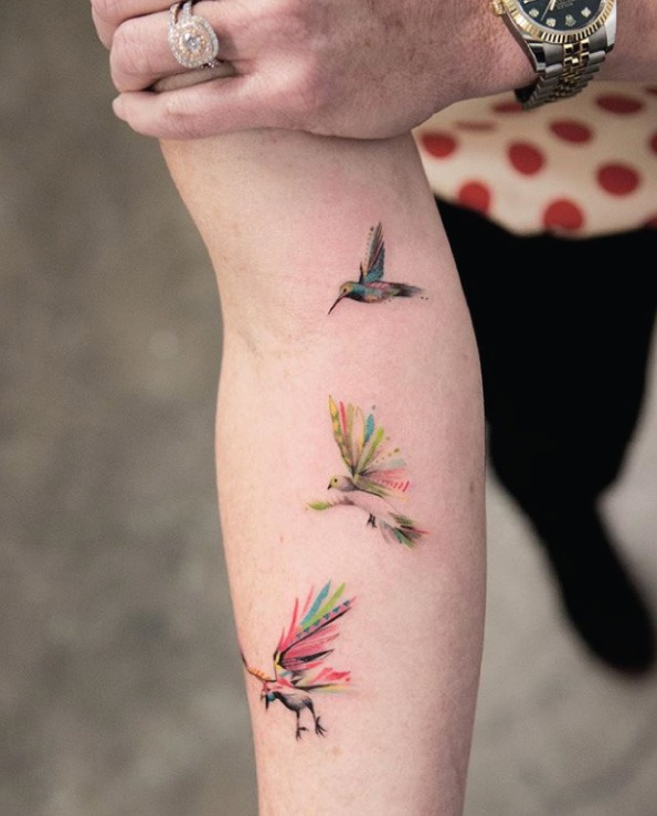 Colorful Hummingbirds in Flight Tattoo Design