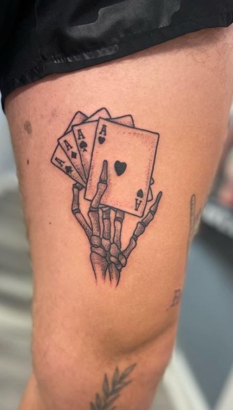 Skeleton Hand with Aces Tattoo Design