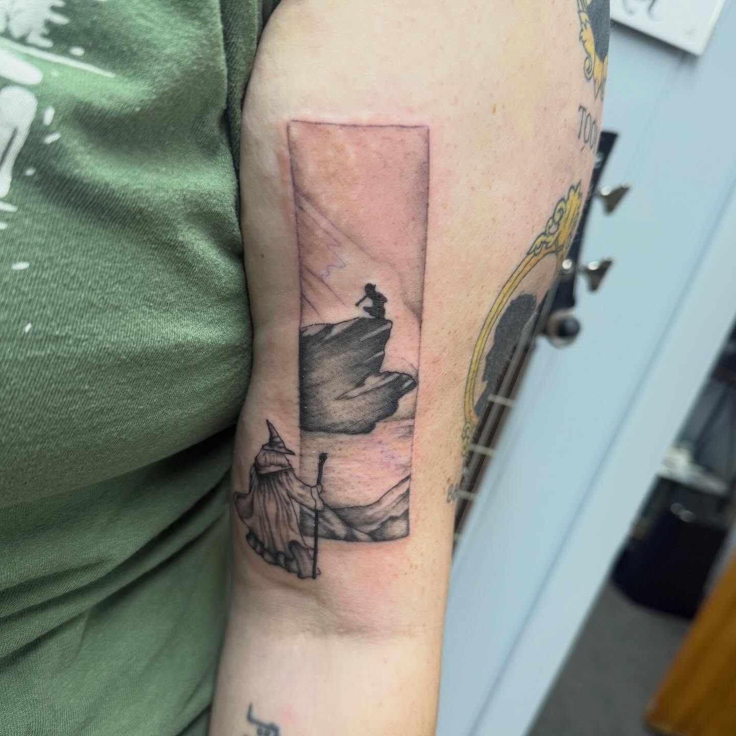 Wizard and Mountain Cliff Bicep Tattoo Tattoo Design