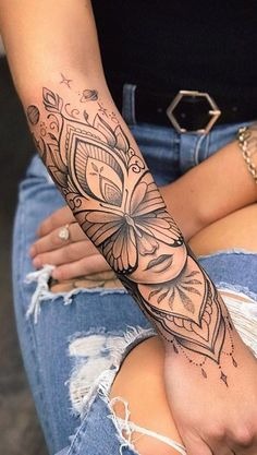 Forearm Tattoo with Symbolic Elements Tattoo Design
