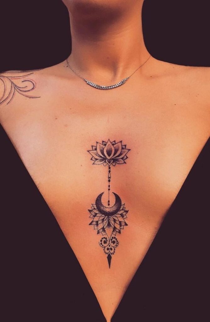 This chest tattoo combines a lotus flower with a crescent moon accent, creating a mystical vibe that's both simple and symbolic.