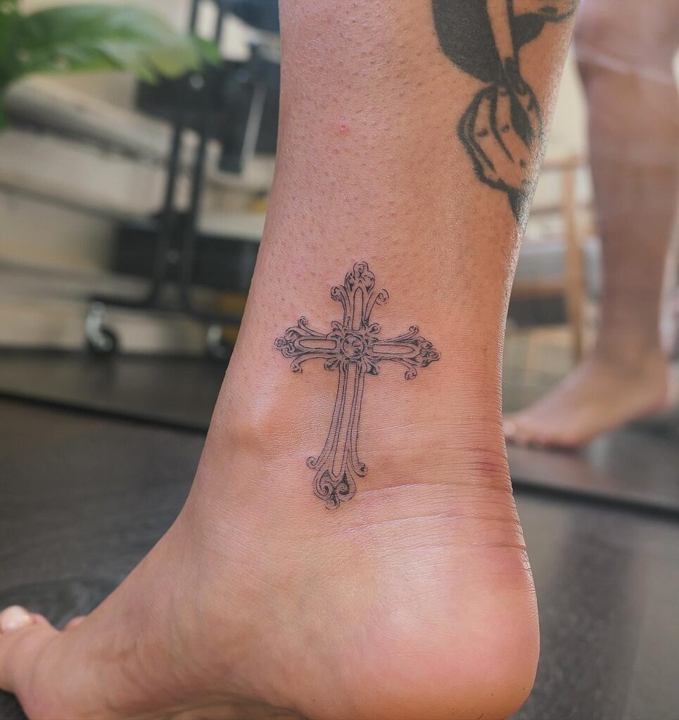 Elegant Floral Cross Tattoo with Name Script Tattoo Design