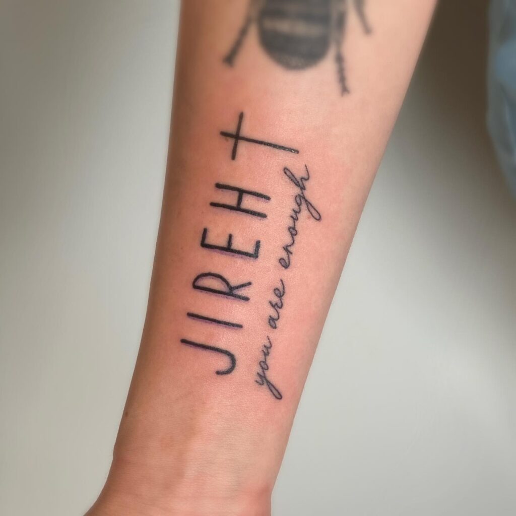 Minimalist Virgin Mary Tattoo on the Rib Tattoo Design