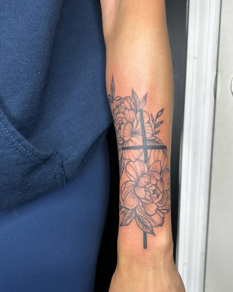 Negative Space Cross with Floral Surrounding Tattoo Tattoo Design