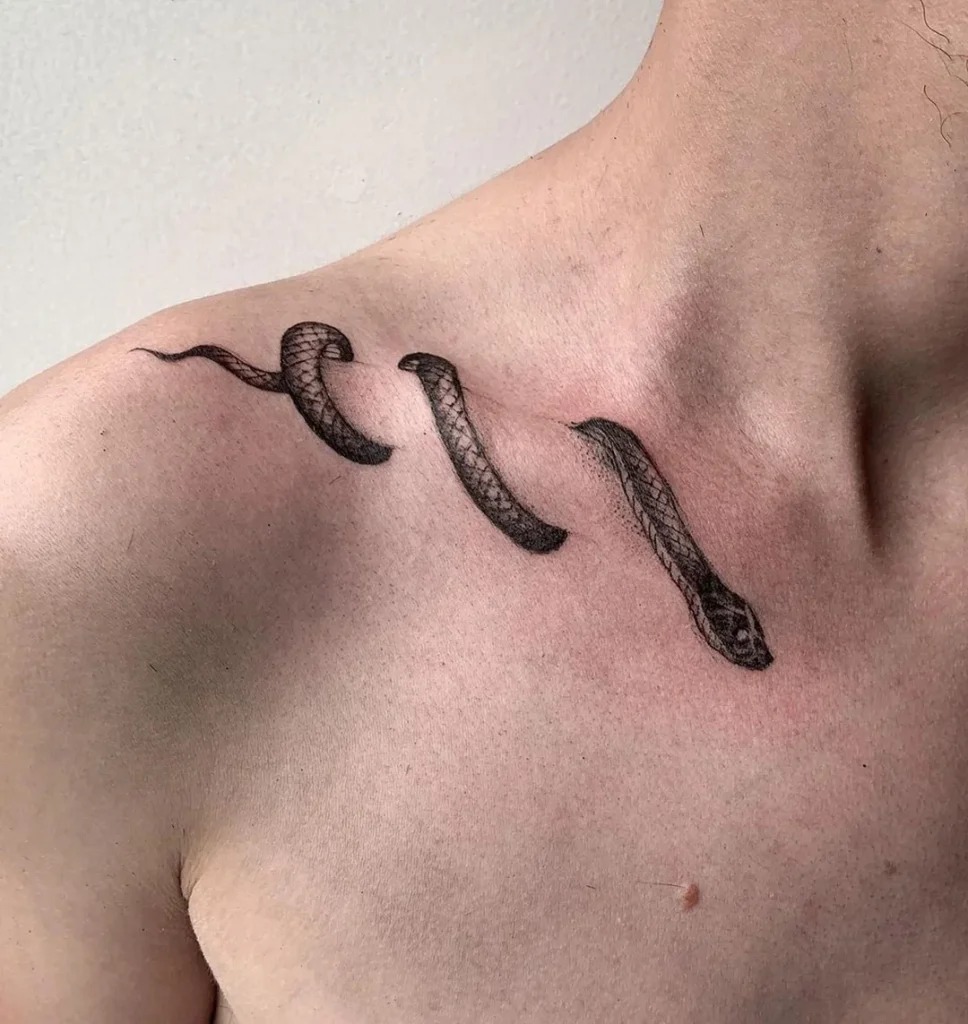 Bold Snake Tattoo Across the Collarbone Tattoo Design